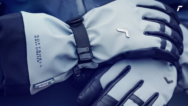 Graue Winterhandschuhe mit schwarzen Lederdetails | © Reusch