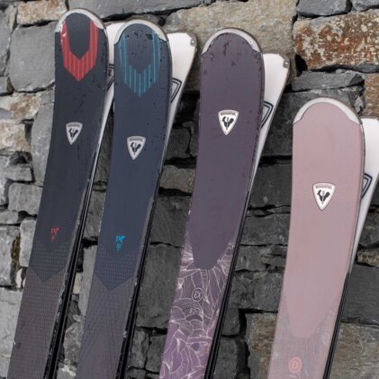 Four pairs of Rossignol skis leaning against a stone wall. | © Rossignol / Blake Jorgenson