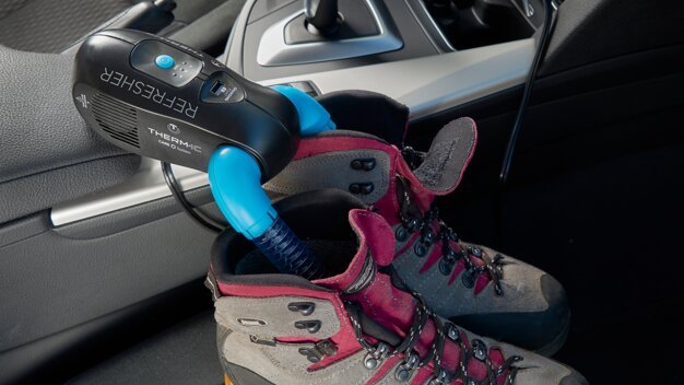 Shoe dryer in car, inserted into hiking boots. | © Thermic
