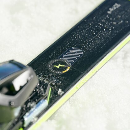 Close-up of a ski on snow