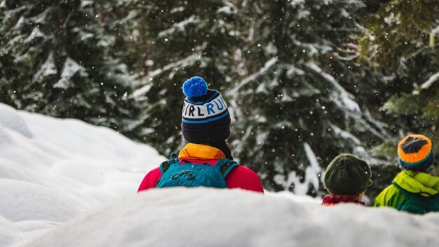 People in winter clothing in snow.