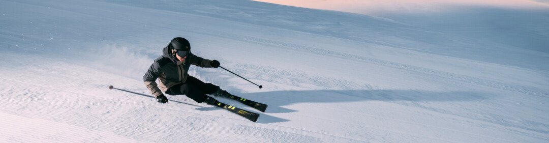 Skier on a groomed ski slope