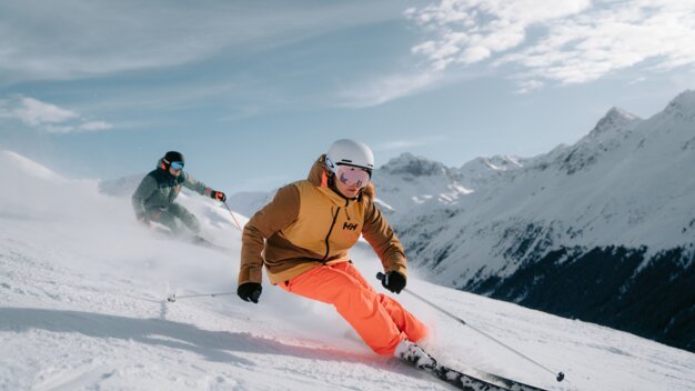Two skiers on a ski slope