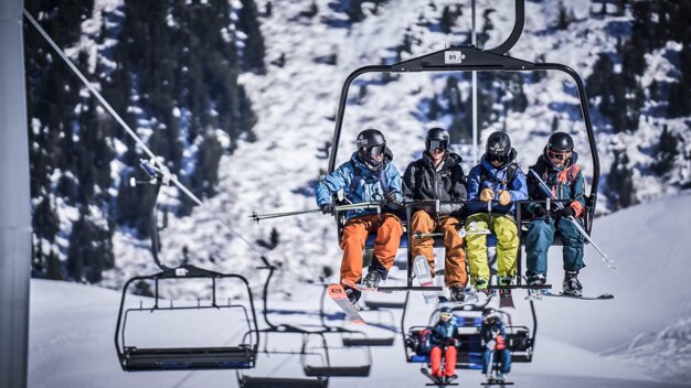 Four skiers on a chairlift | © Les Arcs Wearemerci