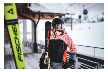 Skier with Fischer skis and Bolle helmet in the snow