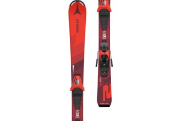 Red Atomic Redster J2 skis with bindings.