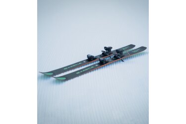 A pair of Kastle Paragon 107 skis on groomed snow.