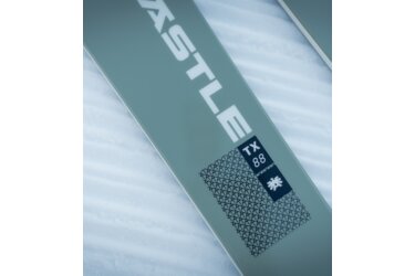 Close-up of a Völkl TX88 ski on snow
