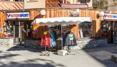 Intersport store with clothing racks in front.