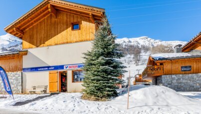Intersport ski rental shop in a snowy mountain village