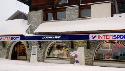 Intersport store in winter with heavy snow.
