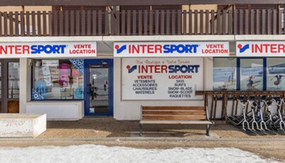 Intersport store with ski equipment.