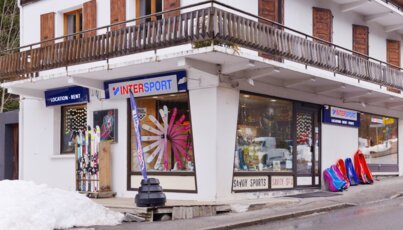 Exterior view of an Intersport store in a ski resort.