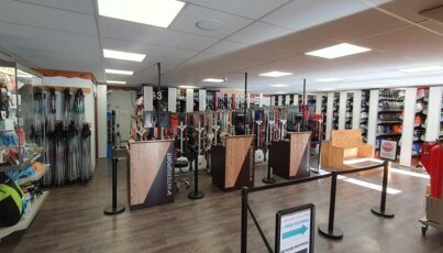 Interior view of an Intersport store with ski equipment.