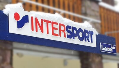 Intersport sign covered in snow