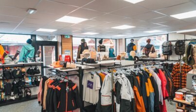 Clothing store interior with winter and sporting goods.