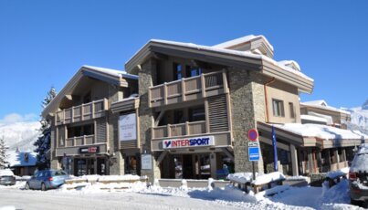 Building with Intersport store in winter.