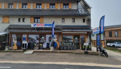 Intersport store with bikes and clothing for rent and sale.