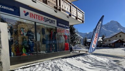 Intersport store in snowy landscape with mountains