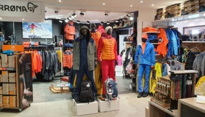 Clothing store interior with mannequins and apparel