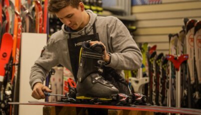 Man mounting ski bindings.