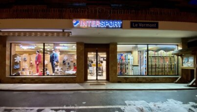 Intersport Le Vermont store at night.