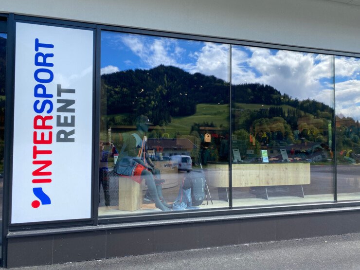 Intersport Rent store with window display and mannequin.