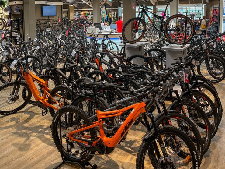 Many bicycles displayed in a shop.